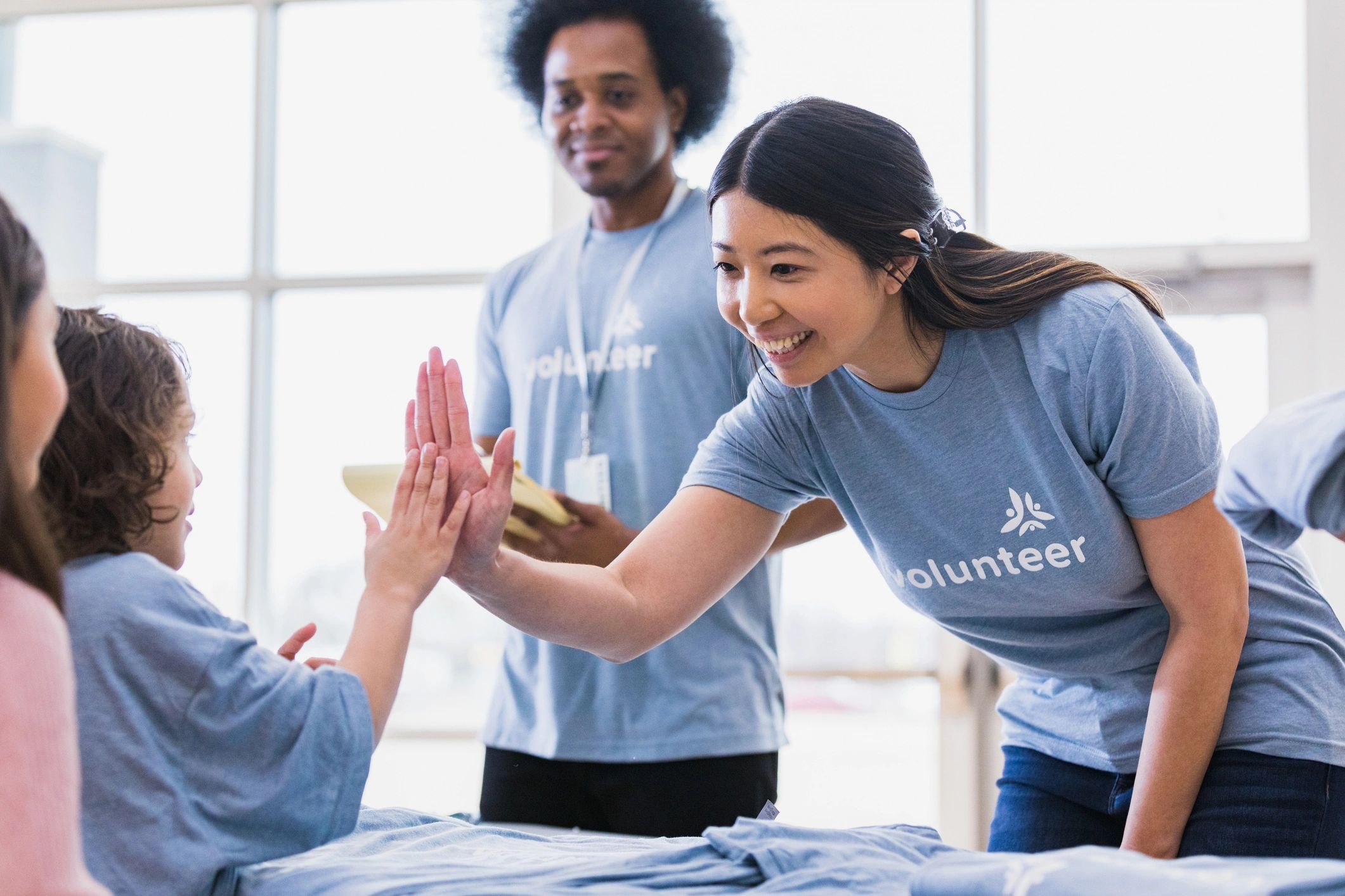 Volunteer sharing a joyful moment during service