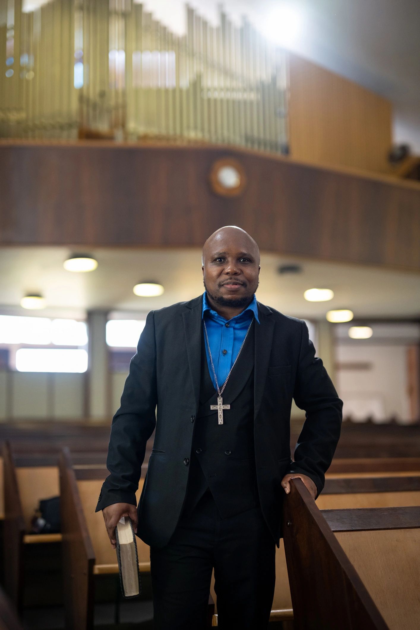 Pastor holding a Bible in the church