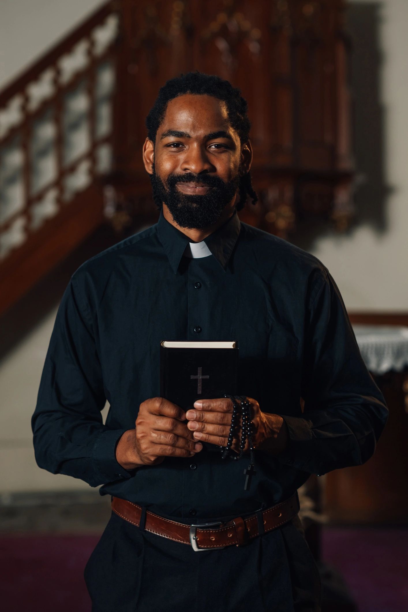 Church leader smiling inside the sanctuary